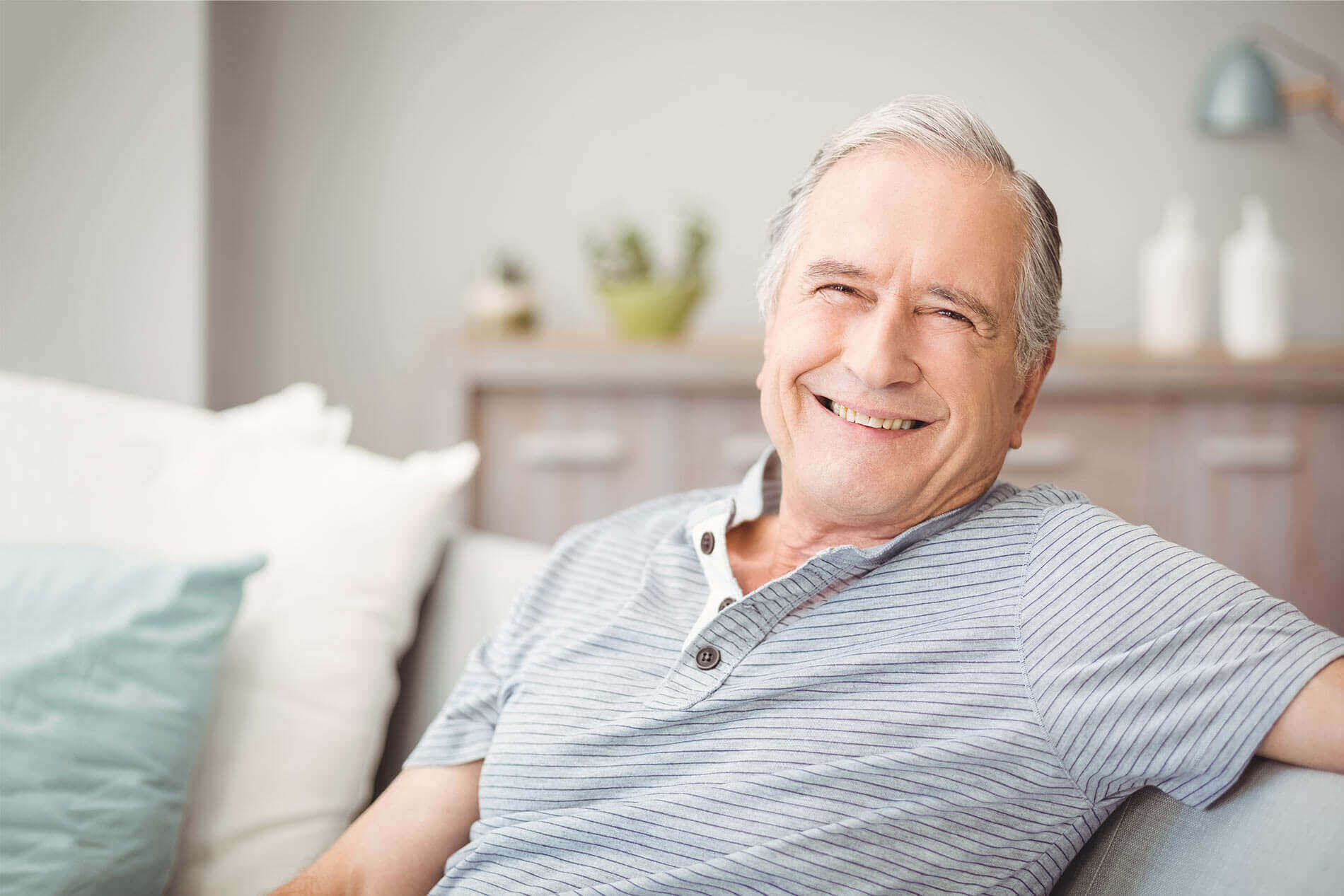 Man on Couch Smiling