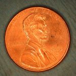 Closeup of an iStent on a Penny to Show How Small it is